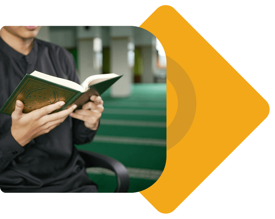 Student reading Quran in Islamic learning environment with decorative design